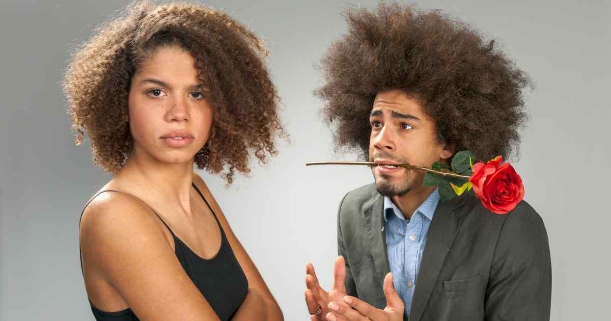 Man begging woman for forgiveness, holding a rose Man begging woman for forgiveness, holding a rose