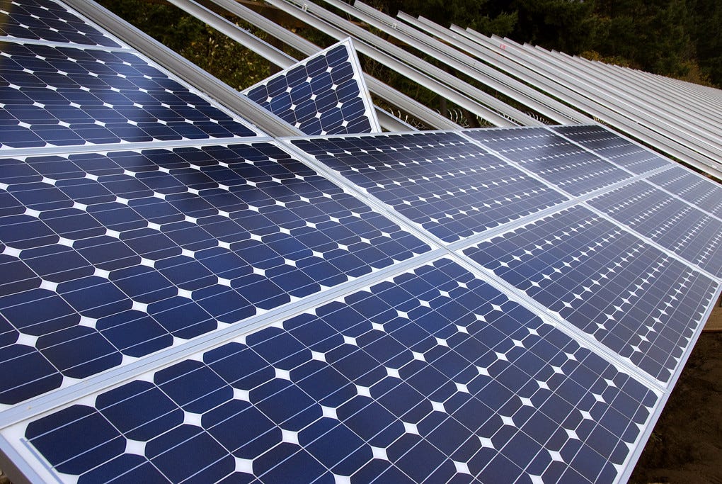 "Installing solar panels" by OregonDOT is licensed under CC BY 2.0.