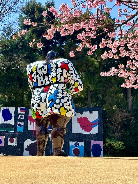 A series of photos depicting Niki de Saint Phalle's Nanas sculptures.