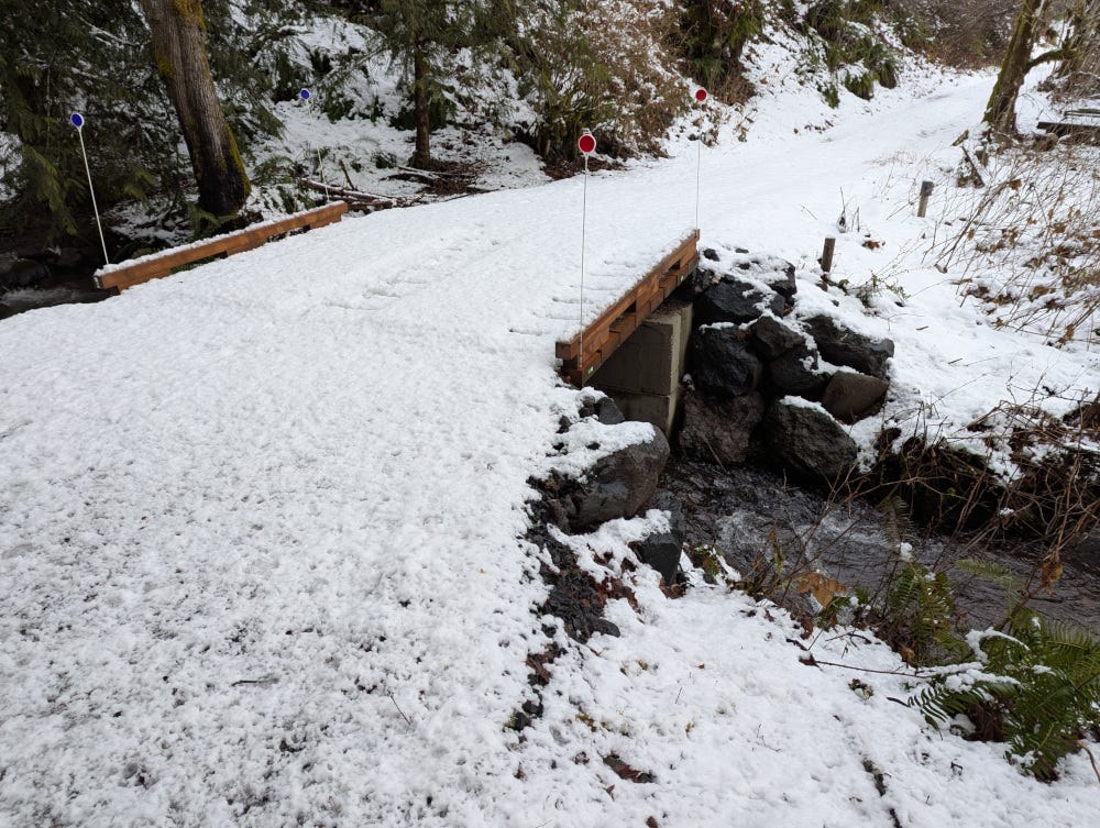 The new driveway bridge, covered with a light dusting of snow
