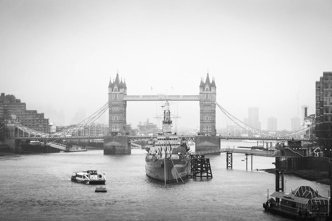 a boat in the water in front of a bridge a boat in the water in front of a bridge