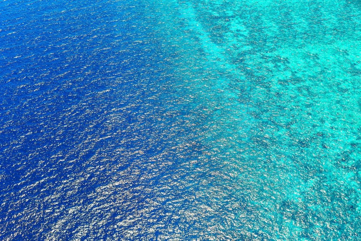 Photo by Asad Photo Maldives - bird s eye view of sea water Photo by Asad Photo Maldives - bird s eye view of sea water