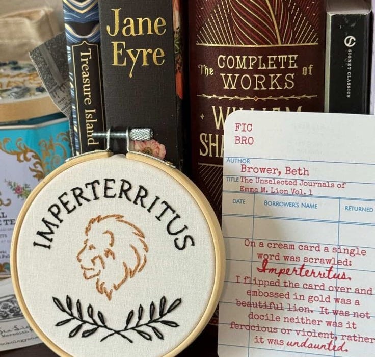 This may contain: there is a cross stitch pattern and some books This may contain: there is a cross stitch pattern and some books