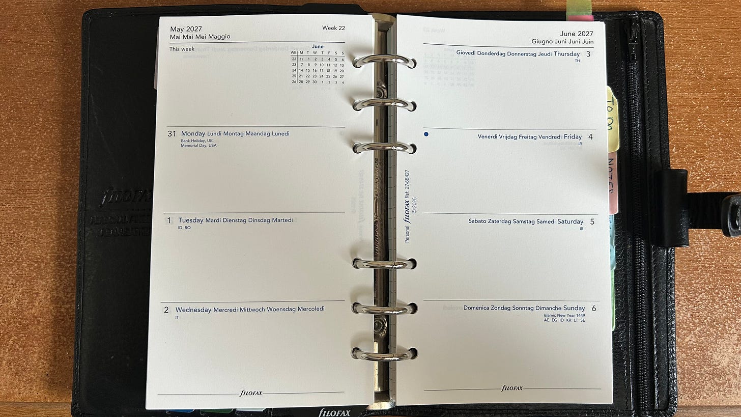 An open Personal size Filofax showing a week to two pages diary insert. An open Personal size Filofax showing a week to two pages diary insert.