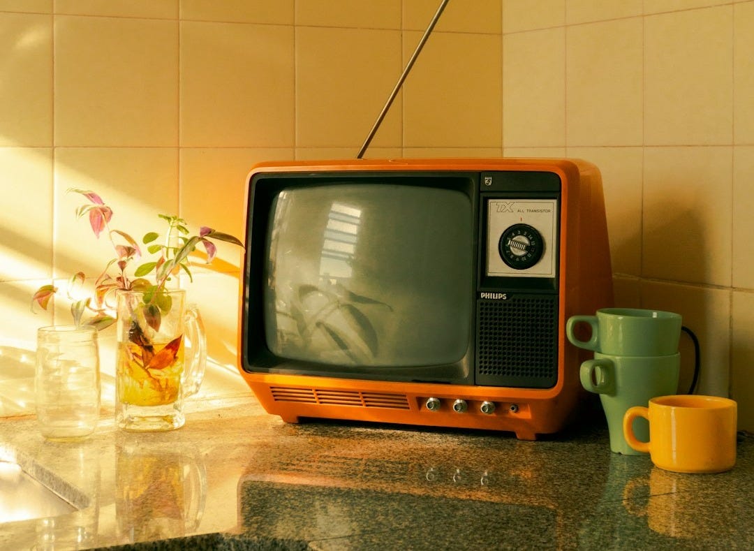 brown crt tv on brown wooden table