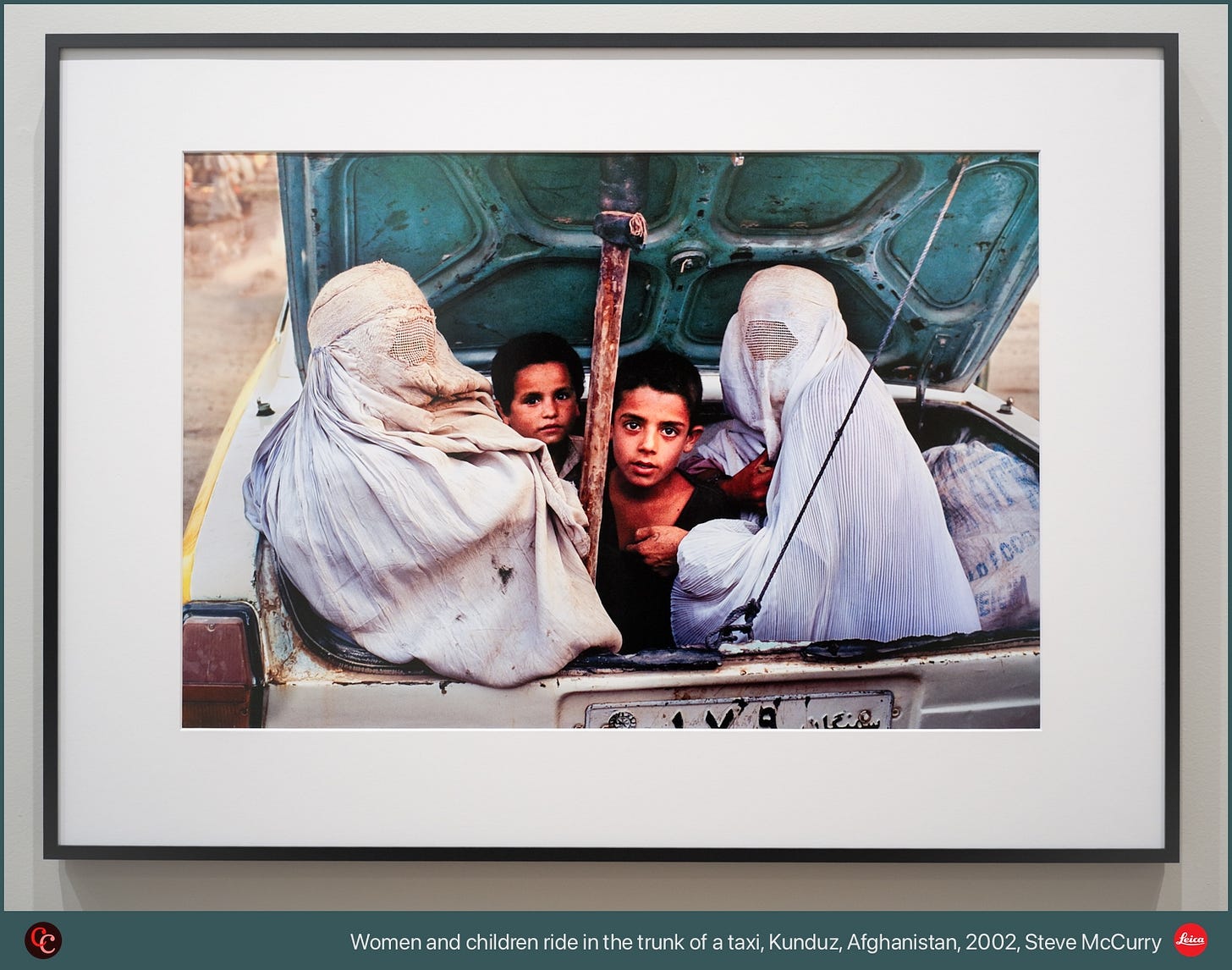Women and children ride in the trunk of a taxi, Kunduz, Afghanistan, 2002, Steve McCurry Women and children ride in the trunk of a taxi, Kunduz, Afghanistan, 2002, Steve McCurry