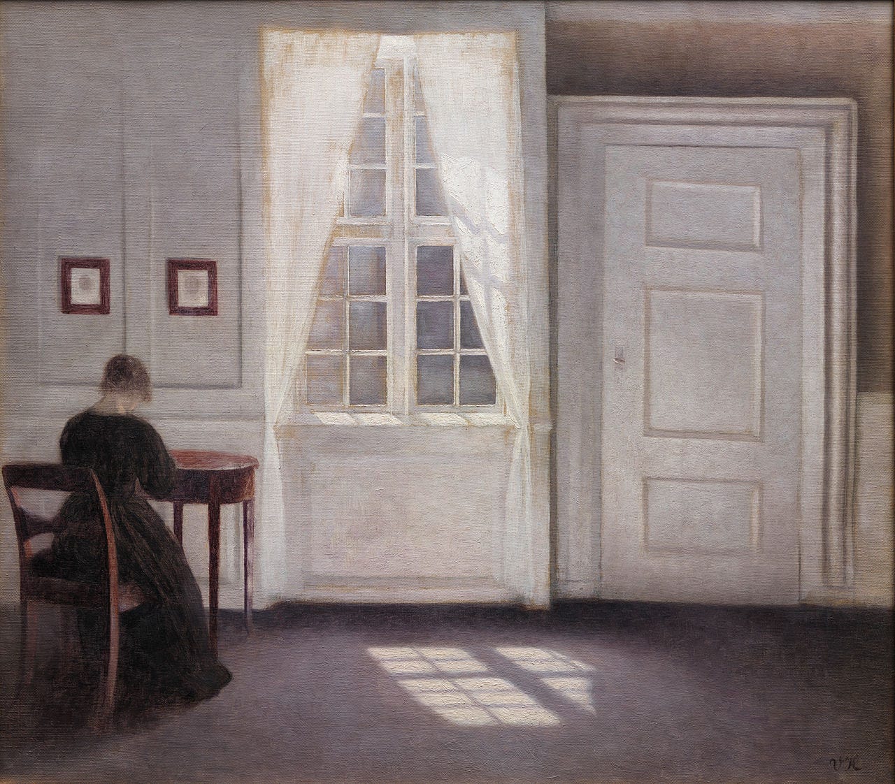 Sunlight pooling on the floor of a bare gray room Sunlight pooling on the floor of a bare gray room