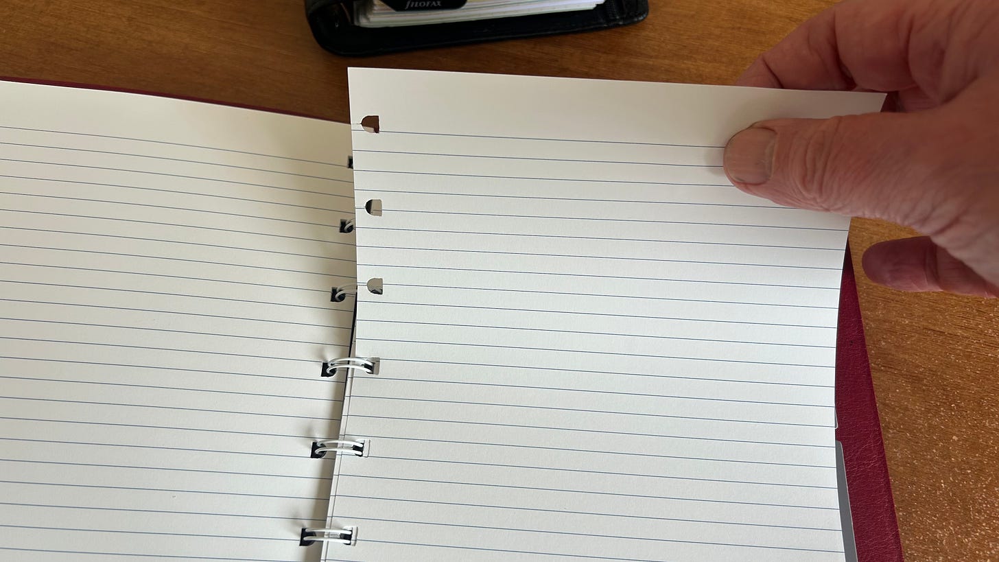 Demonstating how the pages in a Filofax Refillable Notebook are removed by applying gentle pressure from the top of the page and pulling towards the bottom of the notebook. Demonstating how the pages in a Filofax Refillable Notebook are removed by applying gentle pressure from the top of the page and pulling towards the bottom of the notebook.