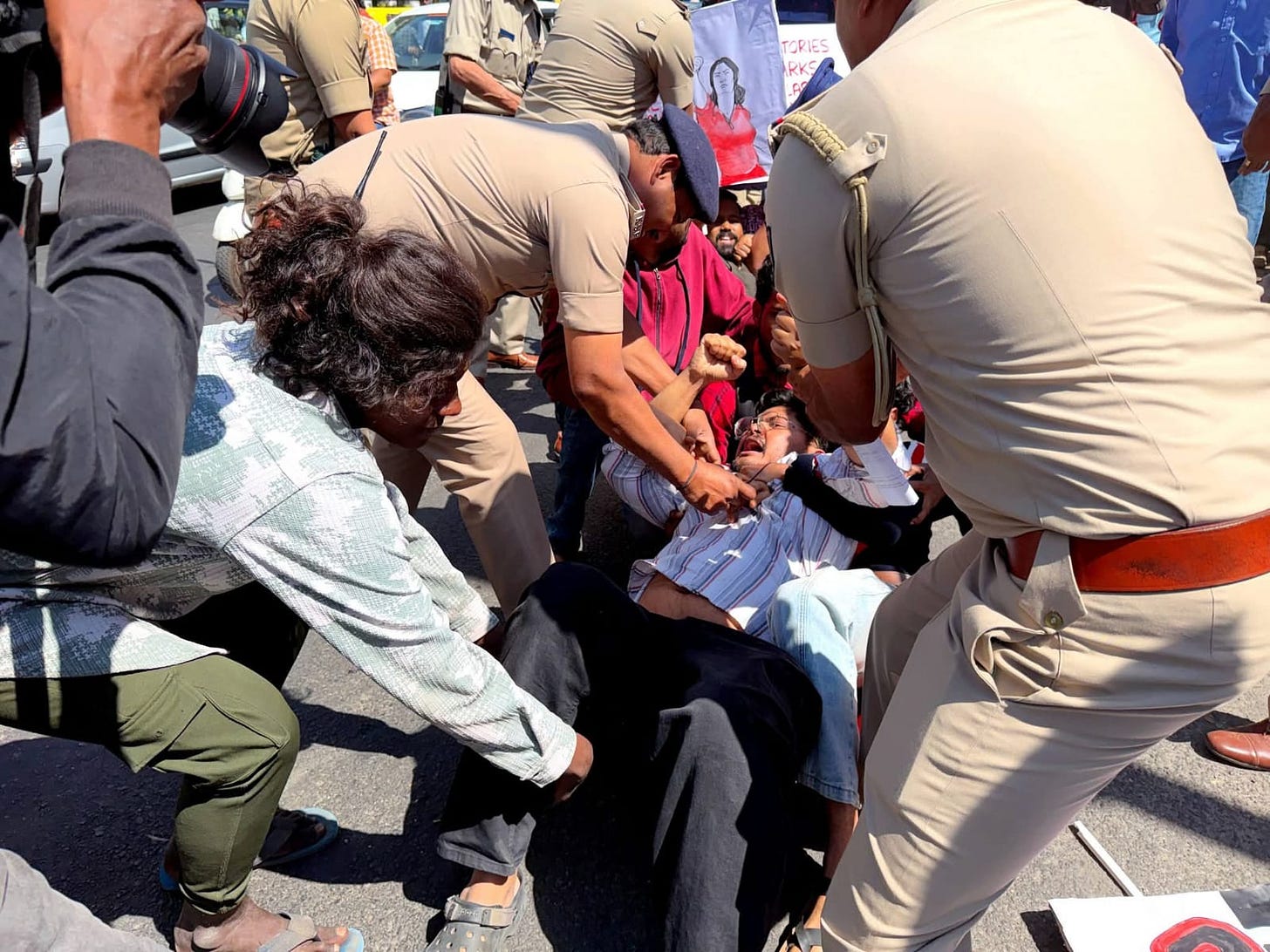 KITU General Secretary, Suhas Adiga, being forcefully arrested KITU General Secretary, Suhas Adiga, being forcefully arrested