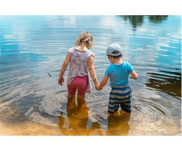 A child and child holding hands in water

AI-generated content may be incorrect.