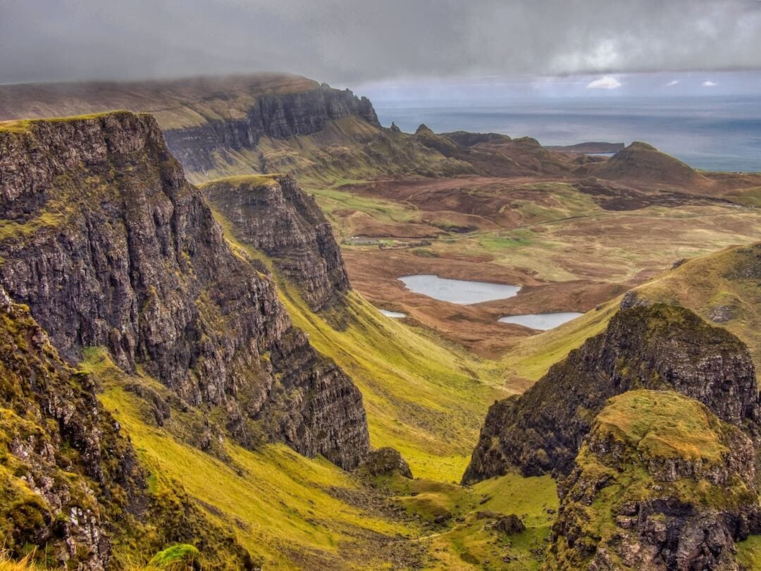 View of a ridge and two small lochs through a natural gulley