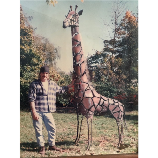 A person standing next to a tree
Description automatically generated with low confidence A person standing next to a tree
Description automatically generated with low confidence