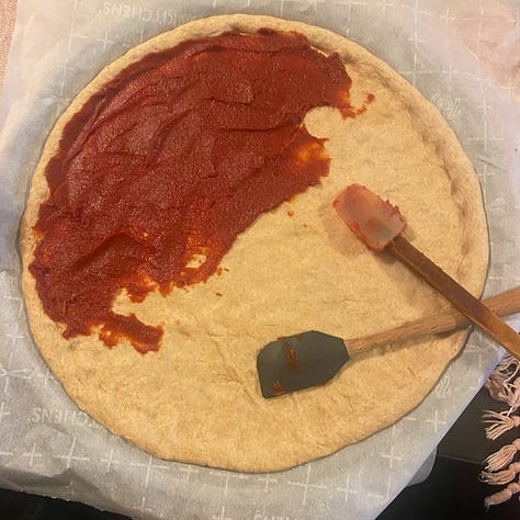 Homemade Pizza with wholewheat crust in three stages of the making.