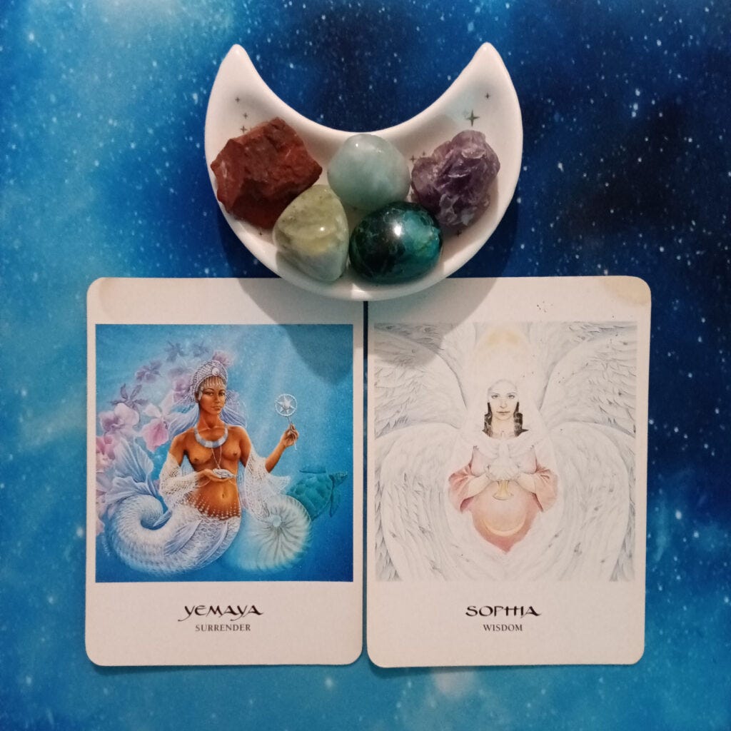 Surrender What You Can't Control: A Message From the Universe, 2 Goddess Oracle cards and crystals on a starry blue background