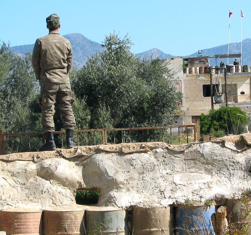 army sentry urinating in front of a turkish army post