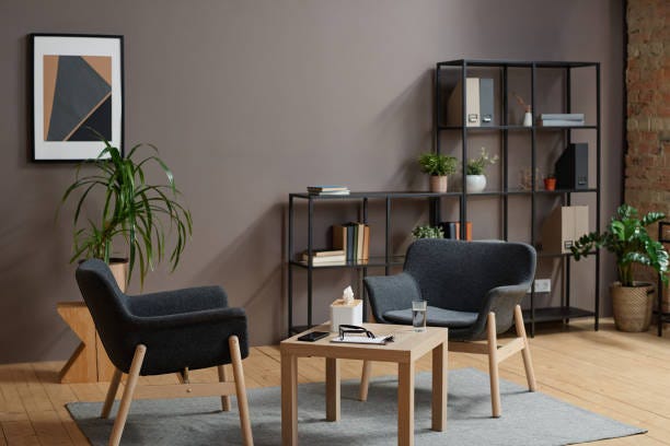Horizontal No People Shot Of Modern Psychologist Office Interior In Gray  And Brown Colors With Two Chairs And Coffee Table Stock Photo - Download  Image Now - iStock