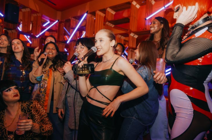 Top events in London this weekend: a group of people doing karaoke together