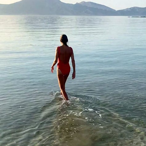 Whitewashed low-rise buildings at Eros Keros, Antiparos, set into a hillside above the Aegean
