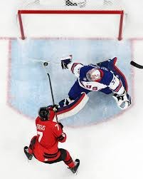 Connor Hellebuyck made a PADDLE SAVE on Devon Toews 😱 #MilanoCortina2026