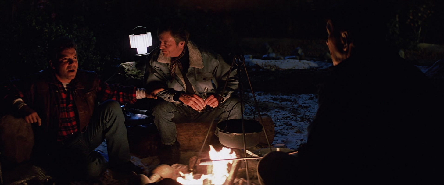 A person sitting by a fire

Description automatically generated