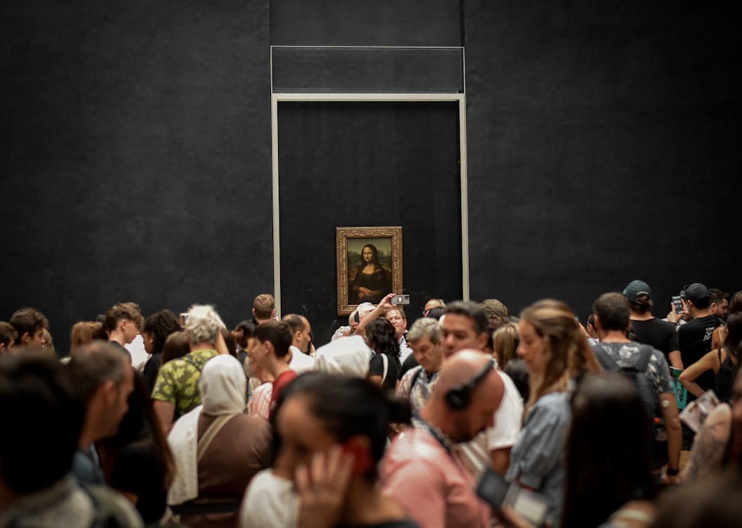 Free Crowd of Visitors in front of Mona Lisa Painting in the Louvre Stock Photo