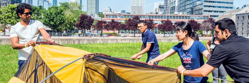 A group of people set up a tent in Montreal.