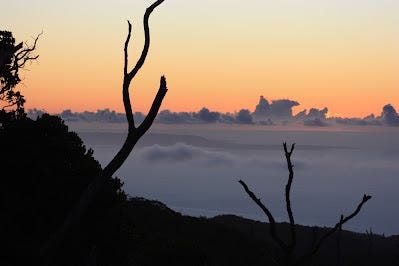 a cloudy sunset, where you can look over the clouds