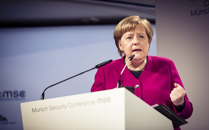 Photos of Angela Merkel, chancellor of German, dressed in blazers of various colors, speaking at a podium and shaking the hands of world leaders 