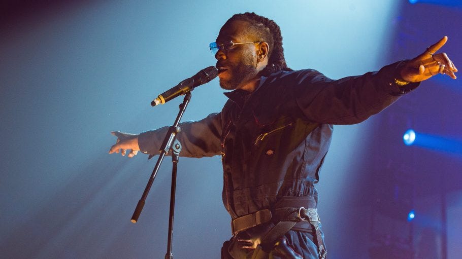 Burna Boy in all black onstage