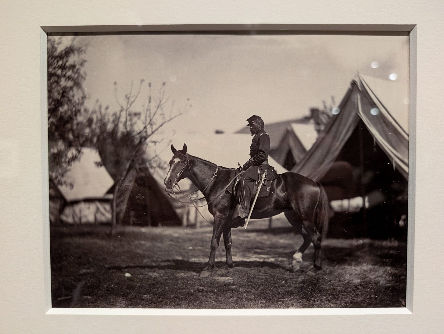 Black-and-white Civil War-era photograph by Alexander Gardner showing Lieutenant Colonel Charles B. Norton on horseback in front of tents near Antietam, Maryland, dated October 3, 1862.