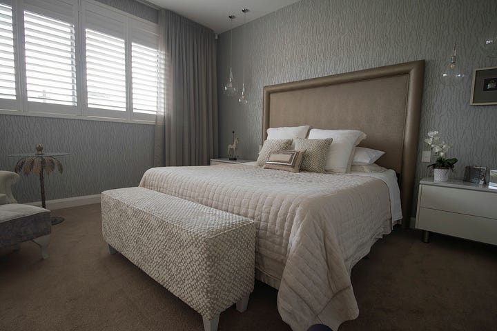 luxurious main bedroom in an apartment designed by Plush Design Interiors and Penelope Herbert