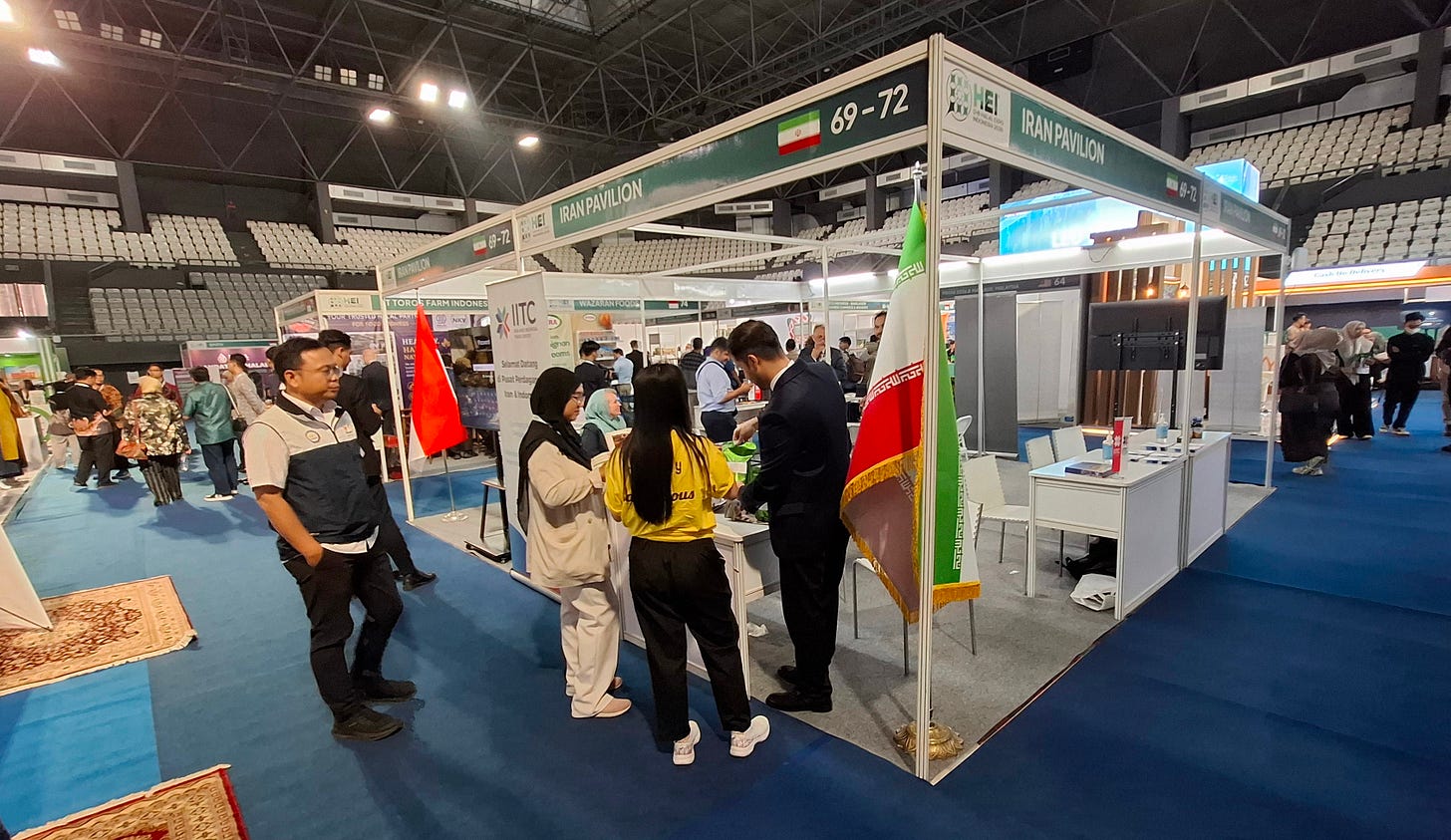 Visitors speak with a business owner at the Iran Pavilion during the opening of the D-8 Halal Expo Indonesia 2026 Visitors speak with a business owner at the Iran Pavilion during the opening of the D-8 Halal Expo Indonesia 2026