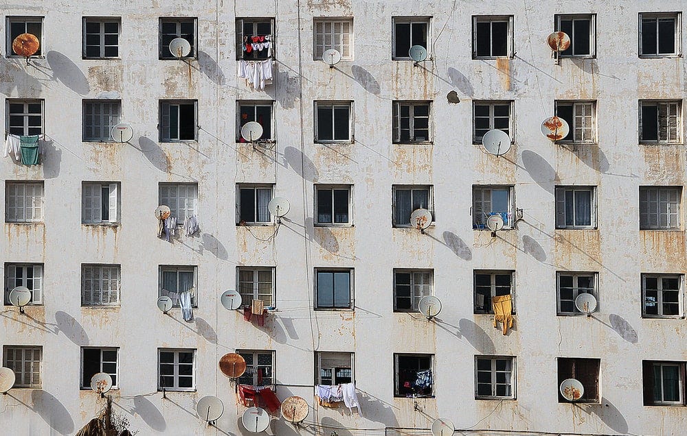 white and brown concrete building white and brown concrete building
