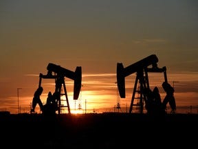 Pump jacks operate in an oil field in Midland, Texas.