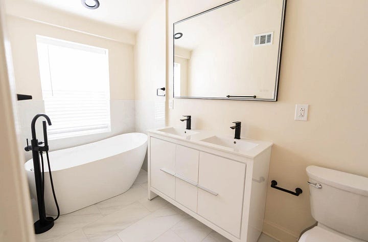 primary bedroom, sitting area and bathroom