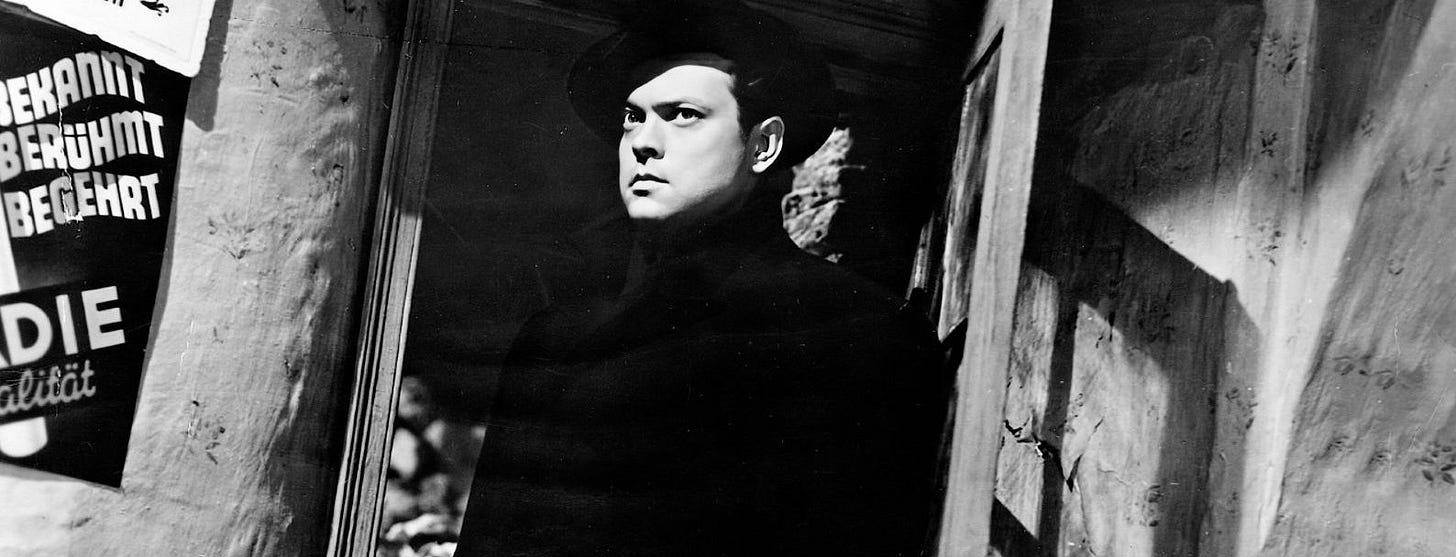 Orson Welles as Harry Lime, looking sinister in shadowed doorway The Third Man