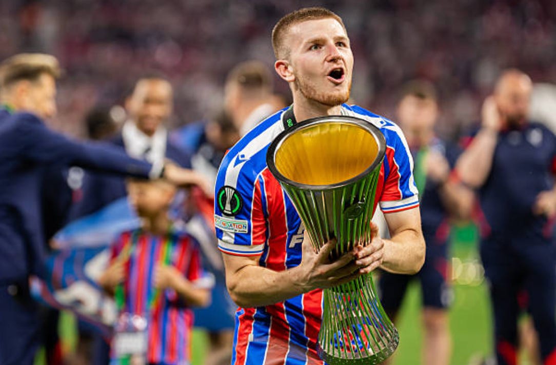 Adam Wharton of Crystal Palace celebrates his team's win LEIPZIG, GERMANY - 2026/05/27: Adam Wharton of Crystal Palace celebrates his team's win with the trophy during the ceremony after the UEFA Conference League Final 2026 match between Crystal Palace FC and Rayo Vallecano de Madrid at Football Arena Leipzig. Final score; Crystal Palace FC 1:0 Rayo Vallecano de Madrid. (Photo by Mikolaj Barbanell/SOPA Images/LightRocket via Getty Images) Adam Wharton of Crystal Palace celebrates his team's win LEIPZIG, GERMANY - 2026/05/27: Adam Wharton of Crystal Palace celebrates his team's win with the trophy during the ceremony after the UEFA Conference League Final 2026 match between Crystal Palace FC and Rayo Vallecano de Madrid at Football Arena Leipzig. Final score; Crystal Palace FC 1:0 Rayo Vallecano de Madrid. (Photo by Mikolaj Barbanell/SOPA Images/LightRocket via Getty Images)