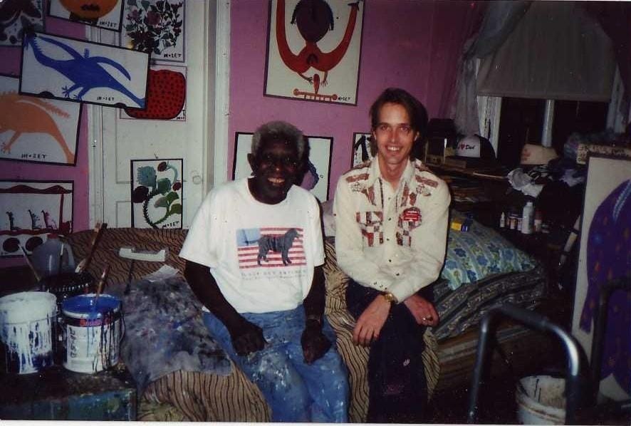 A couple of men sitting on a bed

AI-generated content may be incorrect.