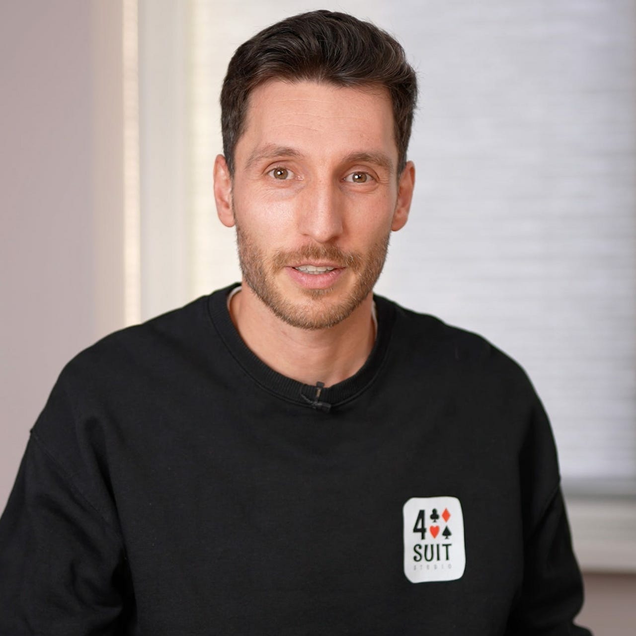 Four Suits ♠ ♥ ♦ ♣ logo