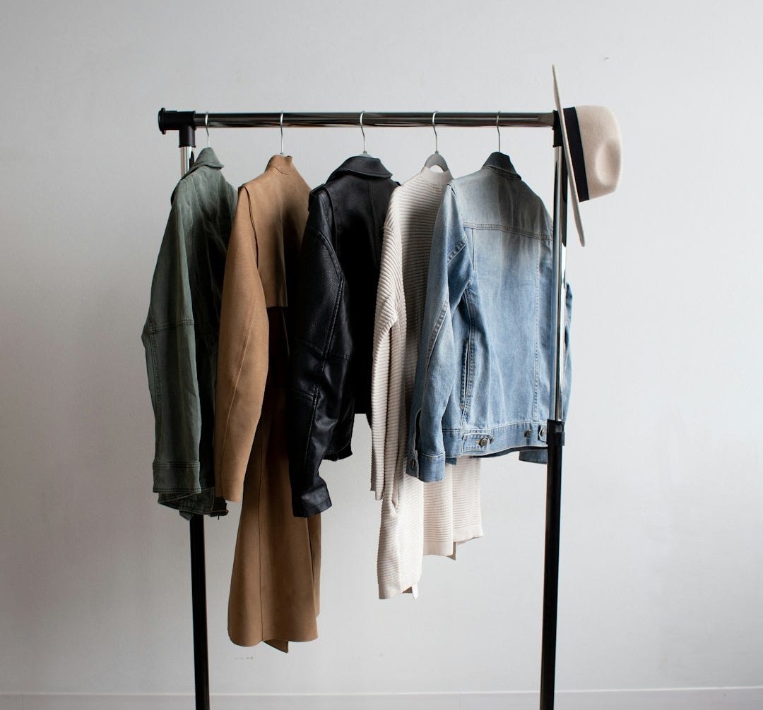 five jackets on clothes rack