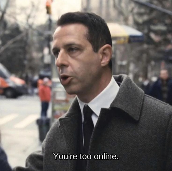 This may contain: a man in a coat and tie standing on the street talking to someone who is holding his hand out