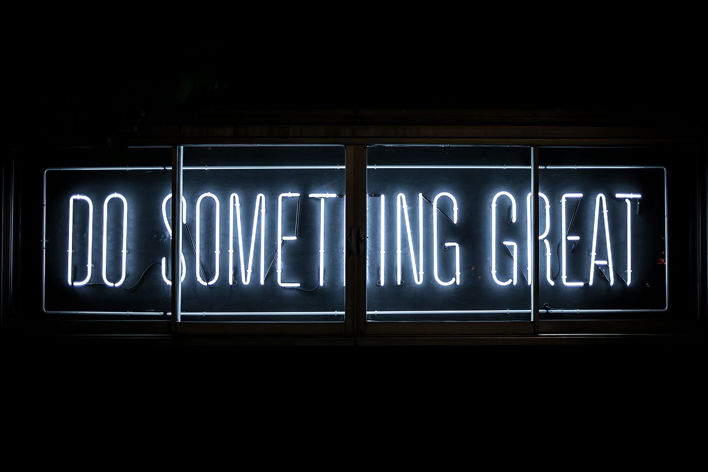 neon sign that reads: "do something great"