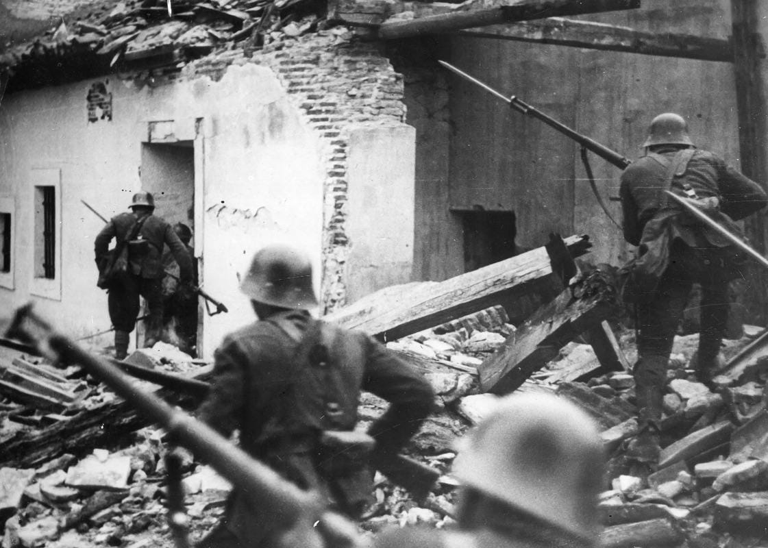 Nationalist troops navigate the devastated ruins of Madrid homes after relentless bombing campaigns, circa 1937, during the brutal Spanish Civil War.