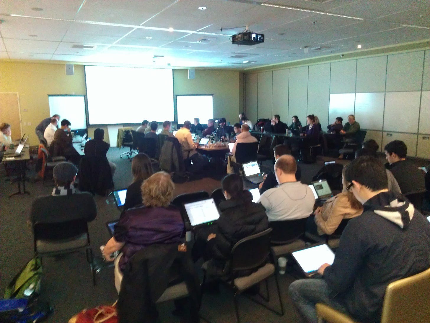 About 50 people looking at laptops as the downloads and installs of the Consumer Preview take place. About 50 people looking at laptops as the downloads and installs of the Consumer Preview take place.