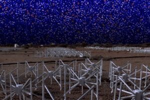 The image of the radio sky (background) is the ‘cleanest’ signal ever produced using data from the Murchison Widefield Array (foreground). Credit: Nunhokee et al/ICRAR/Curtin University
