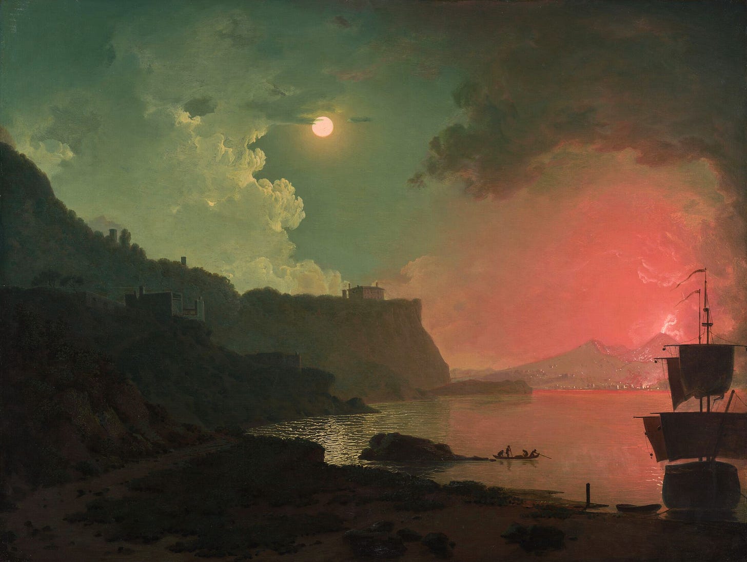 "Vesuvius from Posillipo" by Joseph Wright of Derby: an oil-on-canvas painting depicting Mount Vesuvius erupting in the far distance across a wide, quiet bay at night. The lower third of the composition is dominated by a deep, murky brown shore and shadowed water, where a tiny boat with barely discernible figures rests near the edge. In the mid-ground, a dark, sweeping cliffside rises from the left. The sky above is defined by a striking contrast of light: on the right, a fierce, smoky red glow bursts from the volcano, while on the left, a brilliant full moon pierces through pale clouds, casting a slender, silvery reflection onto the dark water below. Part of the In the Flesh series at The Subtext Review.