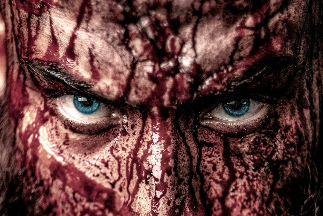 a close up of a man with a beard and blue eyes a close up of a man with a beard and blue eyes