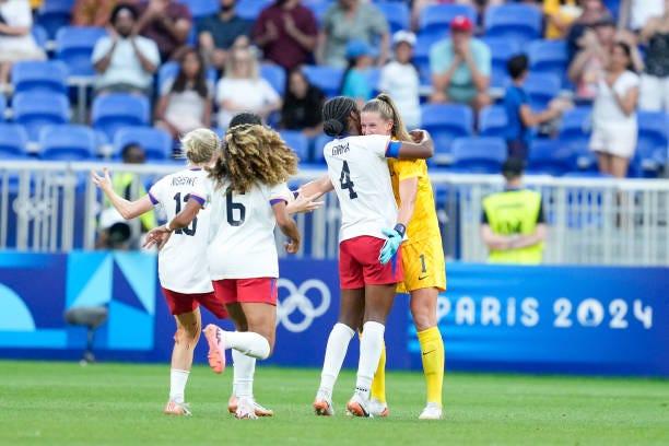 Goalkeeper Alyssa Naeher of United States celebrates with teammates Jenna Nighswonger, Casey Krueger and Naomi Girma after their victory and entry... Goalkeeper Alyssa Naeher of United States celebrates with teammates Jenna Nighswonger, Casey Krueger and Naomi Girma after their victory and entry...