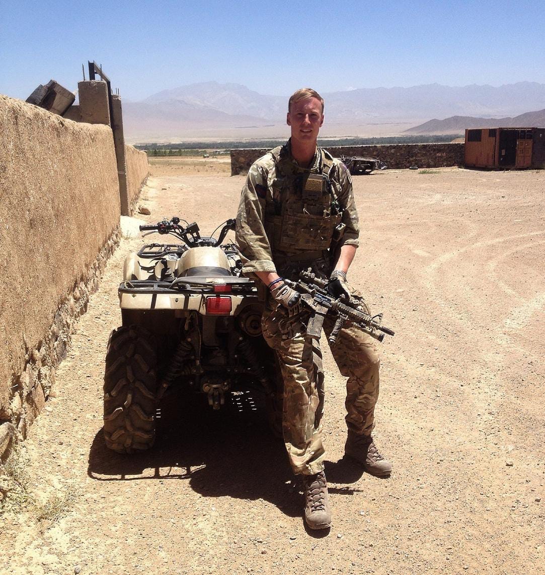 A person in military uniform holding an object

AI-generated content may be incorrect.