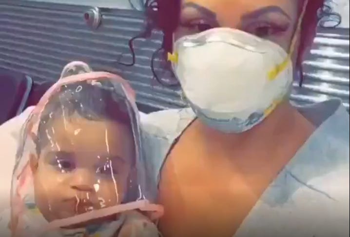 women puts plastic bag over child's head to save him from covid vius